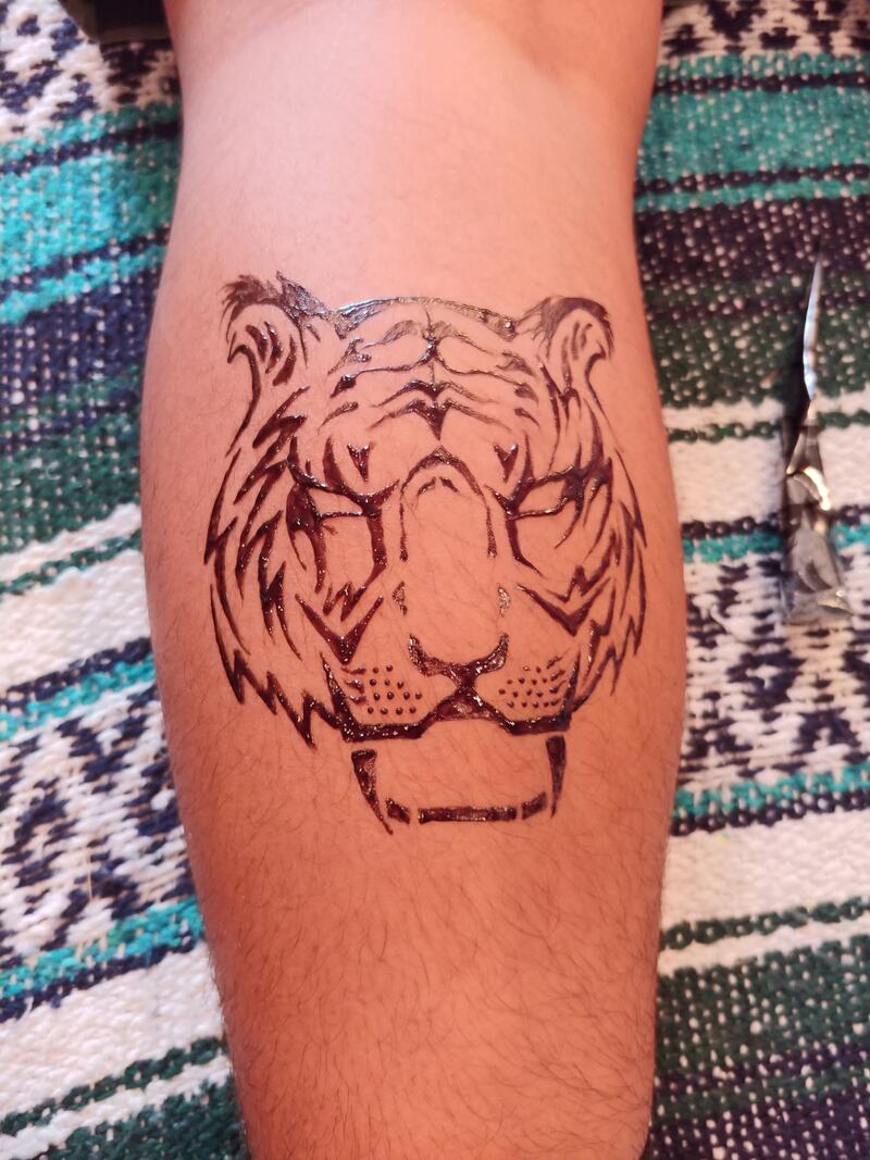 mens henna tiger design on calf