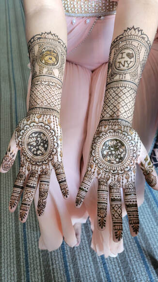 bridal mehndi design with grids and lotus pattern