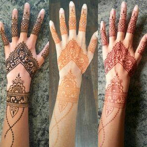 The natural henna progression with a dark henna with orange henna and a red henna hand