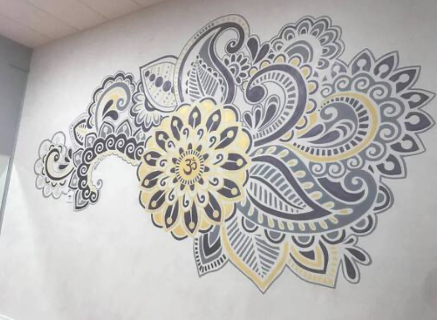 henna style mandala wall mural in a yoga studio